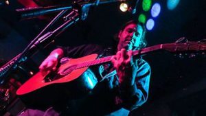 guitar player in colorful lighting